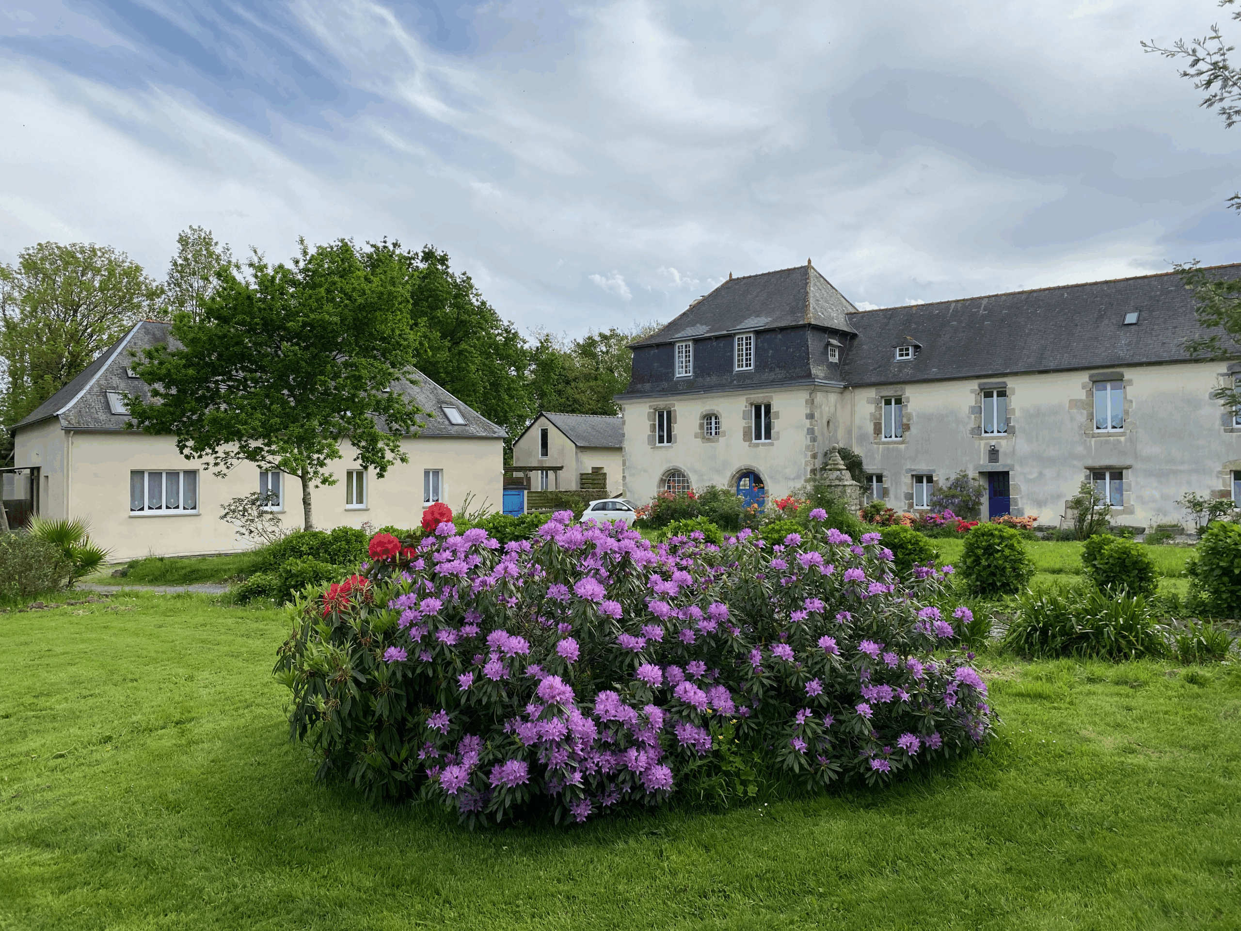 Manor and gite with flowers in the foreground